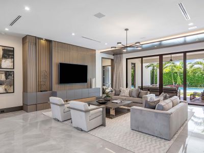 Royal Palm Way living room with ceiling lighting and in ceiling speakers in neutral colors