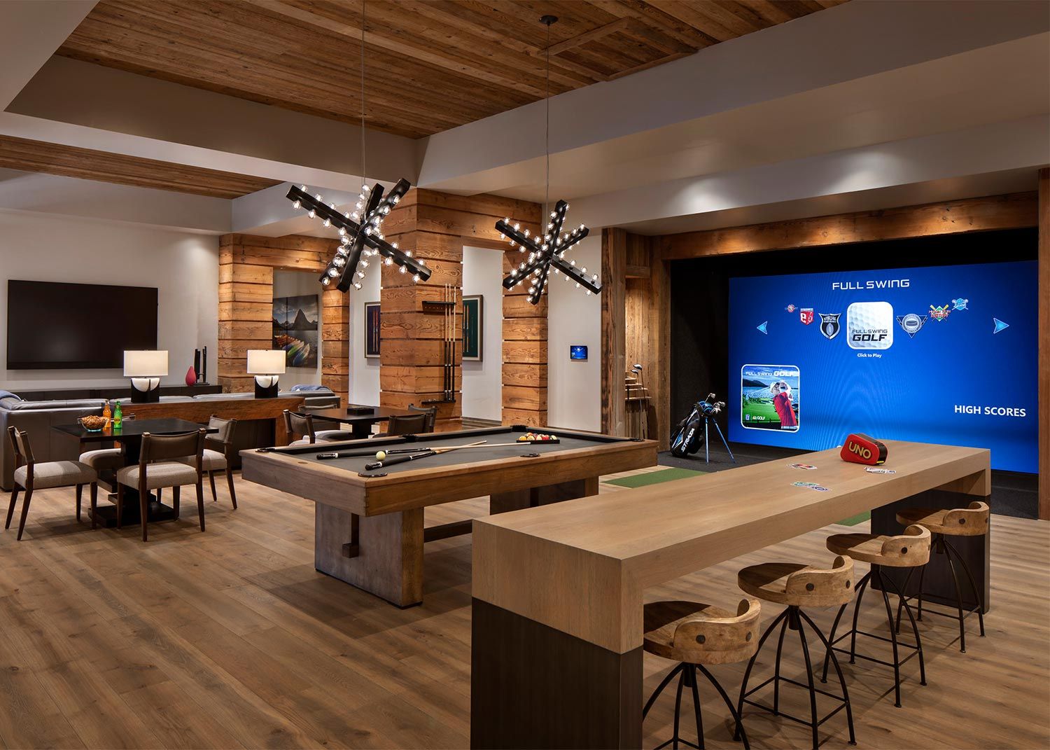 Game room in wood colors with a Golf Simulator, a pool and a ping pong table