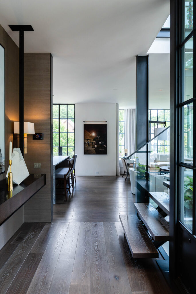 Entryway with a wall-mounted control panel and sconce lighting in an Atlanta home