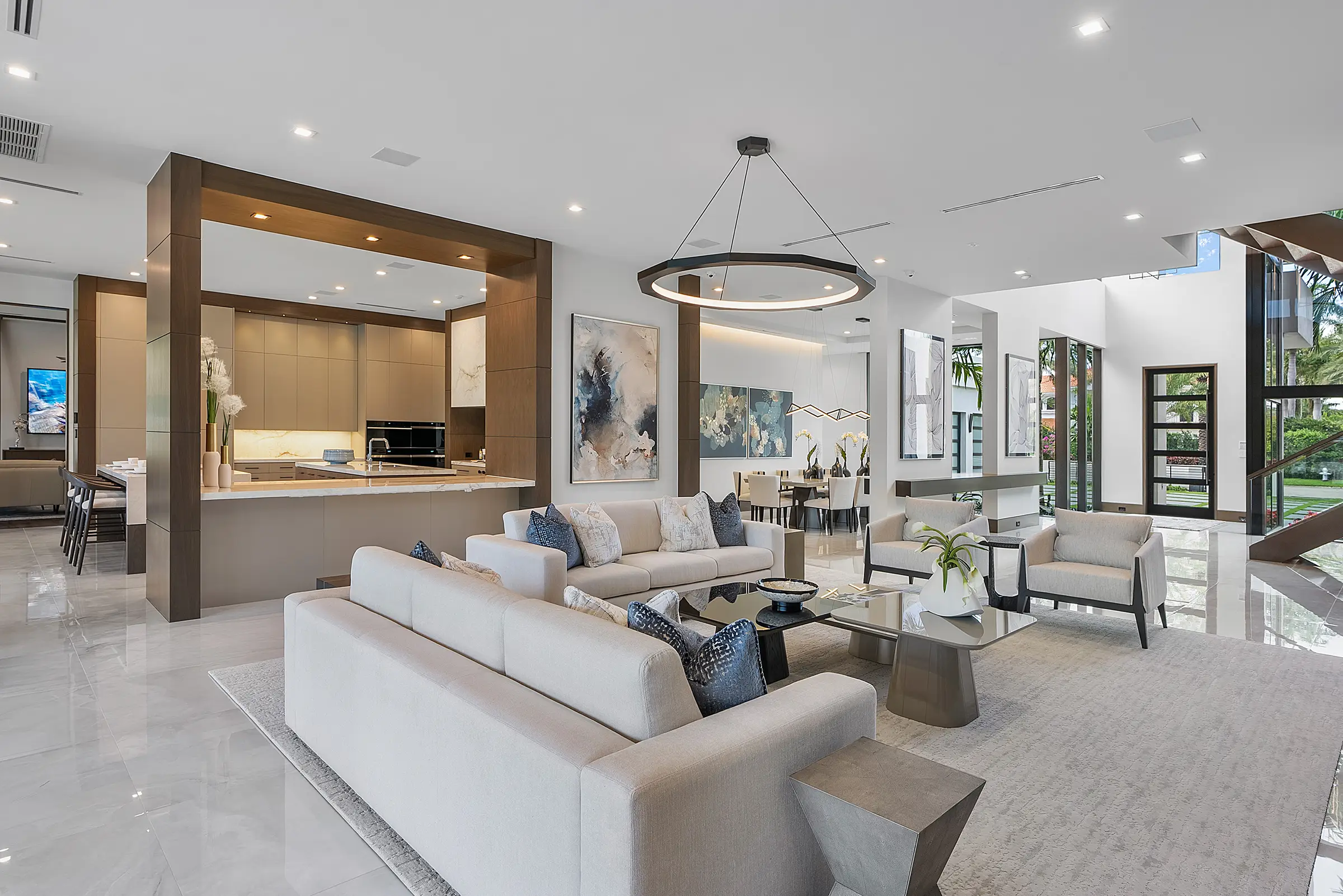 Open living area with integrated lighting and a modern kitchen in a Boca Raton home